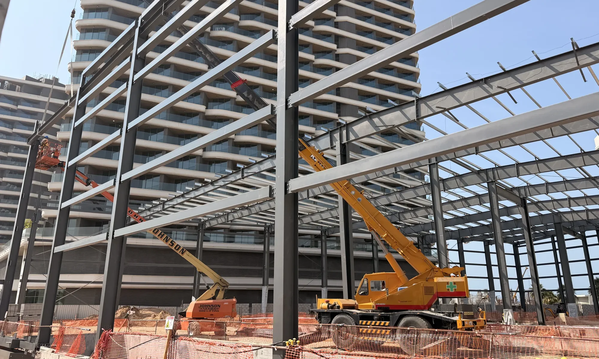 Mobile crane lifting a rafter into position